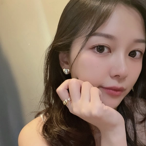 S925 sterling silver heart earrings and mixed-metal ring set on a fashion model