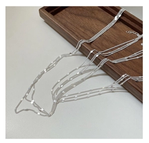 Detailed view of S925 sterling silver triple lace chain necklace with shiny flat sequins