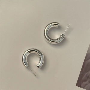 Minimalist S925 sterling silver C-shaped hoop earrings with a high-polished metallic finish