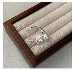 Detail of S925 silver pearl ring with unique molten lava texture and adjustable band