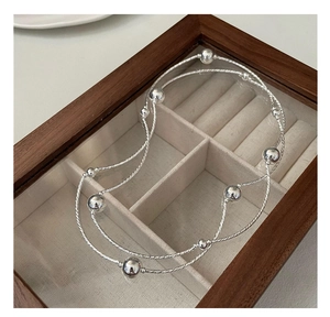 Close-up of S925 sterling silver multi-layer twisted chain bracelet with polished beads