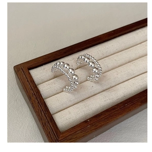 Detail of S925 sterling silver C-hoop earrings featuring triple-row gradient bead strands