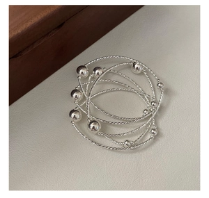 Close-up of S925 sterling silver multi-layer beaded bracelet with twisted rope texture