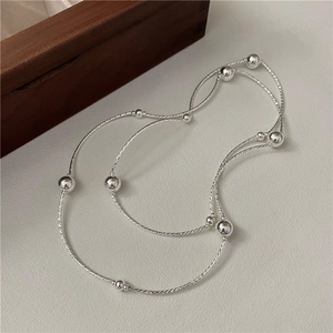 Elegant S925 sterling silver multilayer beaded chain bracelet on minimalist wooden tray