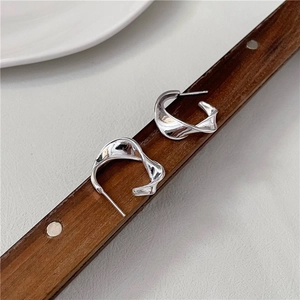 Minimalist S925 sterling silver hoop earrings with wave texture on dark wood handle