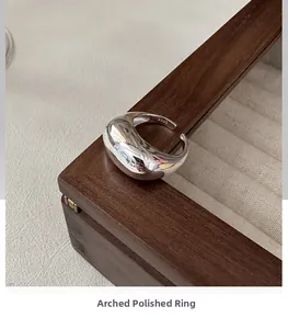 Detailed close-up showing the S925 sterling silver hallmark inside the smooth arched ring