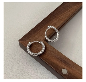 Detailed view of S925 sterling silver beaded hoop earrings with a secure hidden clasp closure