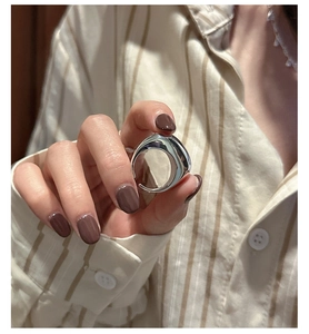 Polished S925 sterling silver chunky irregular ring shown on a model's hand