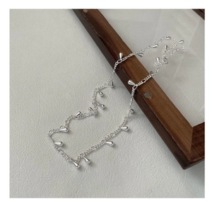 Detail of silver S925 necklace featuring sleek waterdrop charms on a fine chain link