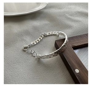 Detail of S925 sterling silver bracelet with textured cuff and chunky chain link