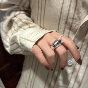 Polished S925 sterling silver chunky ring styled with pearls on a model hand