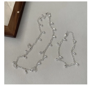 Detailed view of S925 sterling silver necklace and bracelet set with drop tassels