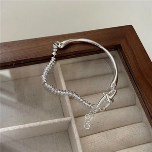S925 sterling silver bangle featuring polished curved bar and threaded abacus beads design