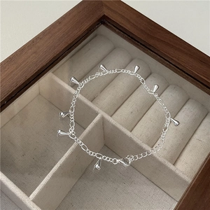 Minimalist S925 sterling silver chain bracelet with polished water drop tassels on display