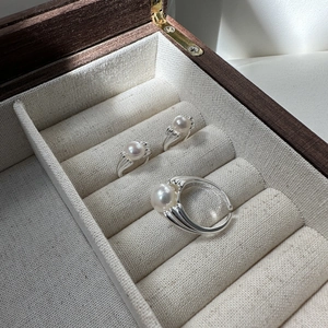 Elegant S925 sterling silver open rings with large white pearls in a jewelry display box