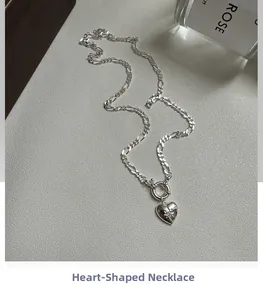Detailed close-up of a S925 sterling silver heart necklace with star engraving