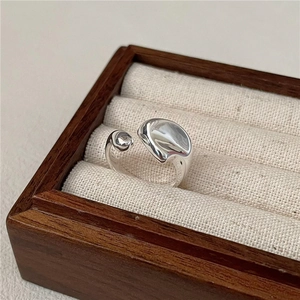 Minimalist S925 sterling silver open ring with irregular organic wave design on wood box