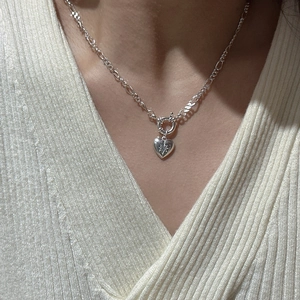 S925 sterling silver heart pendant necklace with star engraving on white knitwear