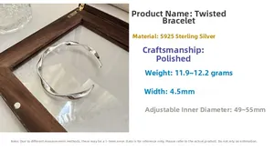 Macro detail of S925 sterling silver twisted wave bracelet with polished finish and specs