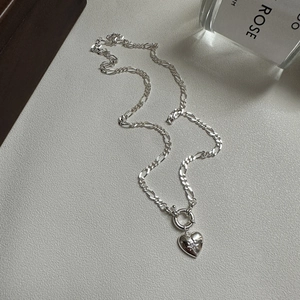 Elegant S925 sterling silver heart necklace with star zircon on a Figaro chain
