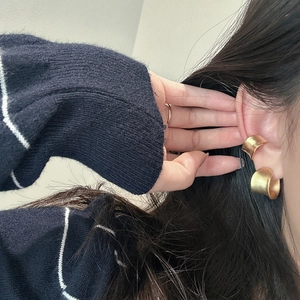Elegant wide gold matte finish S925 sterling silver ear cuffs worn by a model