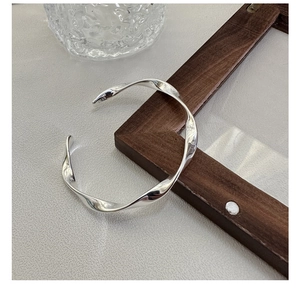 Detailed macro view of S925 sterling silver cuff bracelet showing the hallmark engraving