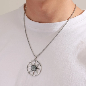 Men's retro silver compass pendant necklace with functional green dial on a pearl chain