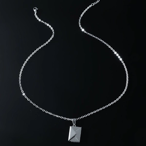Creative silver envelope pendant necklace with fine chain on sleek black background