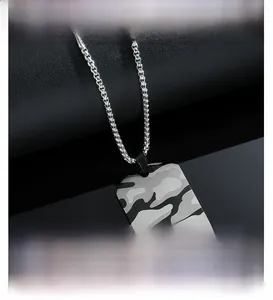 Macro detail of military camouflage dog tag pendant with stainless steel bead chain