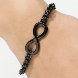 Close-up of black infinity symbol bracelet with box chain worn on wrist for style