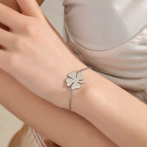 Polished stainless steel lucky clover bracelet for women in a minimalist fashion style