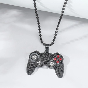 Detailed view of black matte game controller pendant with red and clear rhinestones