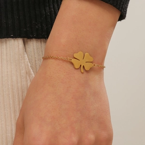Elegant gold plated stainless steel four-leaf clover bracelet on model wrist