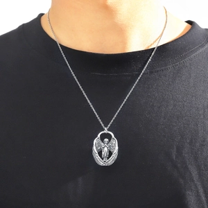 Vintage silver angel wing pendant necklace worn on black t-shirt for hip-hop style