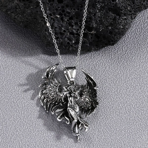 Retro angel wing pendant necklace in silver finish with vintage punk style aesthetic