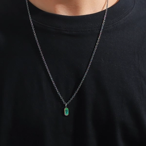 Iridescent stainless steel necklace with number 7 square pendant on a model