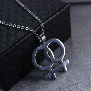 Brushed stainless steel necklace with double female Venus symbols on black jewelry box