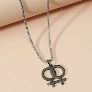 Detail of creative double Venus symbol pendant in black metal on a silver chain
