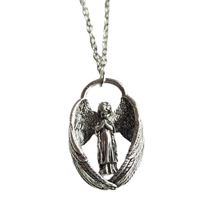 Vintage silver angel wing pendant necklace with detailed praying cherub in oval frame