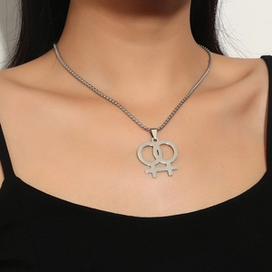 Close-up of interlocking double Venus symbol pendant on a square pearl chain necklace