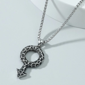 Detail of silver male symbol pendant with rugged lava texture on a sturdy box chain necklace