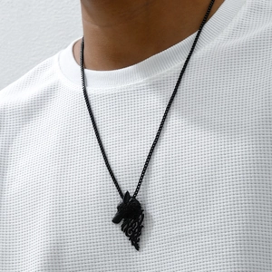Men's vintage black wolf head pendant necklace with box chain on white textured shirt