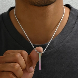 Detail view of rectangular stainless steel pendant with iridescent inlay on a box chain