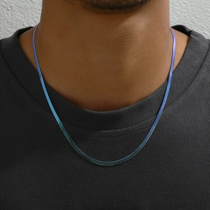 Macro shot of colorful gradient flat snake chain necklace with vibrant metallic finish