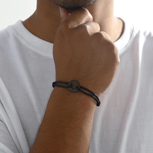 Minimalist black adjustable rope bracelet with a circular ring charm for men and women