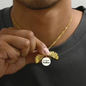 Golden sunflower locket necklace with You Are My Sunshine engraving on inner silver disk