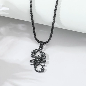 Detail of matte black scorpion pendant necklace with thick rounded box chain