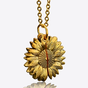Golden sunflower locket necklace with detailed petals and polished metallic finish