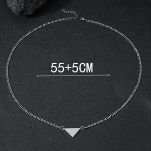 Macro detail of silver geometric triangle pendant with crystals on 55+5cm chain