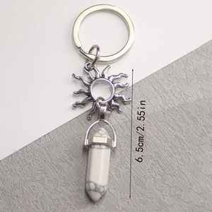 Detail of 6.5cm sun pendant keychain with natural white stone crystal and silver ring